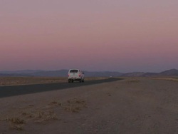 Vehicles driving through dunes, Sossusvlei, Namib-Naukluft, Namibia Stock Footage