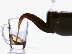 MS SLO MO Coffee being poured in Cup / Vieux Pont, Normandy, France Stock Footage