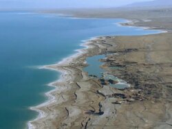 Sinkholes near the Dead Sea, formed by dissolution of underground salt by incoming freshwater, as a result of a continuing sea level drop, Israel, Judea Desert Stock Footage
