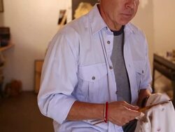 MS TU Shot of portrait of painter cleaning his brushes / Santa Fe, New Mexico, United States  Stock Footage