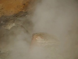 CU Heavy steam surrounding at rock in Krysuvik Geothermal area / Reykjanes peninsula, Iceland          Stock Footage