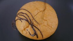 making dark chocolate stripes on bread. close up. Slow motion. Stock Footage