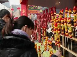 MS sugar coated haws being sold at temple fair for celebrate Chinese spring festival / xi'an, shaanxi, china Stock Footage