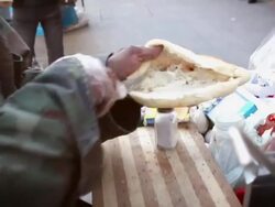 CU Shot of City and street and street vendor making sandwich / Amman, Jordan Stock Footage