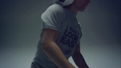 young male soccer freestyler juggles a ball on his neck Stock Footage