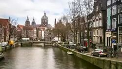 HD time-lapse zoom out: Amsterdam Canal Church of Saint Nicholas Stock Footage