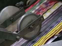 CU Newspapers on conveyor belt in gravure printing office / Itzehoe, Schleswig-Holstein, Germany  Stock Footage