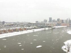 WS Ice chunks float down the Mississippi River near in front of Downtown / Saint Paul, Minnesota, United States  Stock Footage