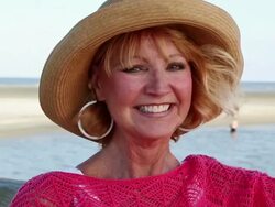 MS PAN Shot of Senior woman at beach / St. Simon's Island, Georgia, United States Stock Footage