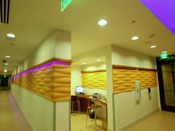 MS TU TD Outside hotel business center walls lined with orange decoration down hall / Wickenburg, Arizona,USA Stock Footage