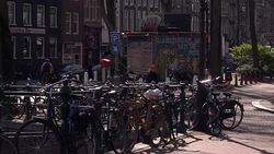Cyclists and canals in heart of Amsterdam News Clip