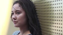 Young female with wind in hair Stock Footage