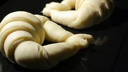 Fermenting and baking croissants Stock Footage