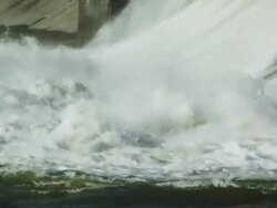 Close up Water spillway behind electricity generating dam Stock Footage