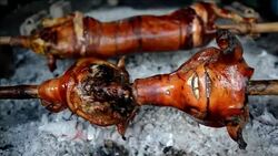 CLEAN : Philippine village parades roasted pigs in religious celebration News Clip