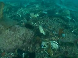 MS POV Under water traveling on sea garbage lot's of shoes and plastics / Mediterranean, Lebanon Stock Footage