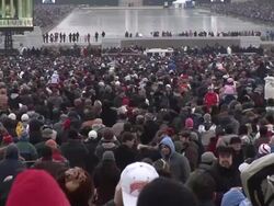 January 18, 2009 WS Spectators watching as large screens show Samuel L. Jackson speaking at the 'We Are One' concert on the National Mall to celebrate the inauguration of Barack Obama/ Washington, DC Stock Footage