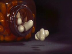 SLO MO - CU medicine bottle falling, white capsules spill out Stock Footage