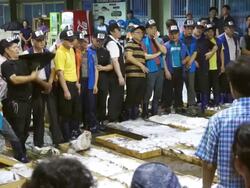 MS Shot of auctioning goods in Mokpo Fisheries wholesale market with buyers / Mokpo, Jeollanamdo, South Korea Stock Footage