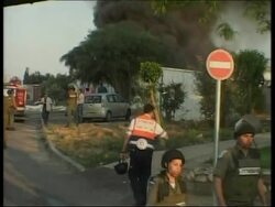 WRAP Israeli artillery grouping at border ADDS two more rockets hit Sderot, factory on fire News Clip