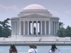 WS Jefferson Memorial in back of the reflection pool with visitors walking around / Washington, District of Columbia, United States Stock Footage