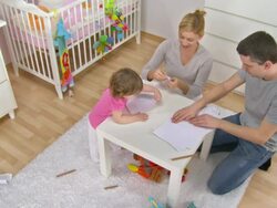 HD: Young Family Making Paper Airplanes Stock Footage