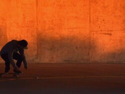 A young man skateboarding in a parking garage. - Slow Motion - filmed at 240 fps Stock Footage