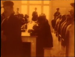 Immigrants eat at long table in the cafeteria at Ellis Island. News Clip