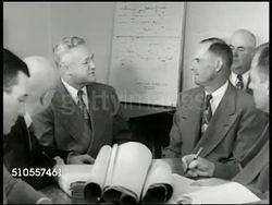 1950: REPRISING MEETING: Board of Education meeting, CU Tillman R. Smith, member talking w/ mayor about suggestions. VS EXT closed one-room school houses, school bell in steeple, boarded door of Graley School. PAN Davenport School in Eureka. Instructional Video