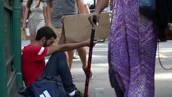 Homeless On Wall Street - Young Man Stock Footage