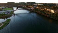 Pennybacker Bridge Austin Texas Aerial View Over Colorado River at Sunset Stock Footage