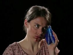 CU, Lockdown, Beaten woman holding an ice pack and touching swollen lip Stock Footage