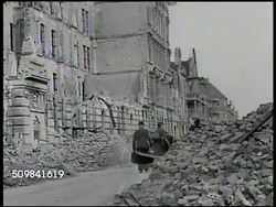 1945: RUINED GERMAN CITIES: WS Ruined German city, refugees walking. WS Rubble of building. World War II, WWII, aftermath, post-war destruction, bombed, debris. Instructional Video