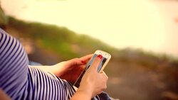 Woman using cellphone for text message Stock Footage