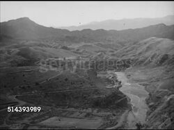 1942: THE KHYBER PASS: HA XWS Khyber Pass (aka Khaiber, Khaybar Pass), HS XWS Camel caravan on curved pass road, WS Camel caravan.   Pakistan, Afghanistan, stragetic location, Islam, Muslim, trade, commerce, passage. Instructional Video