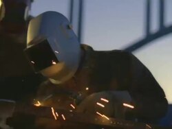 MS Man arc welding next to truck beside under construction bridge at Hoover dam / Mojave, California, USA Stock Footage