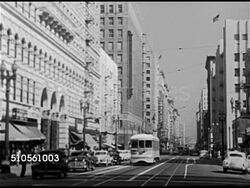 1948: LOS ANGELES, CALIFORNIA: Angled WS Downtown city street w/ cars & cable car. WS Building covering most of the city block. TU WS Richfield Oil Company Building w/ 'Richfield' on tower.  Wealth, power, success, image. Instructional Video