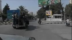 Lebanon - Gunmen take to the streets following killing of security chief / Angry protest after car bomb rocks capital, killing top police officer / Fighting continues between pro and anti Assad forces in northern cities / Army returns fire amid sectarian clashes spilling over from Syria News Clip