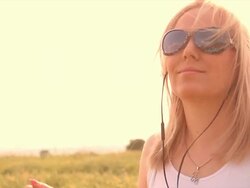 Woman listening to music Stock Footage
