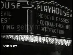 1936: U.S. WORKS PROGRESS ADMIN: INT MS Women looking at photograph collage in theatre lobby. EXT MS WPA Canopy marquee 'Playhouse: The Devil Passes, Federal Theatre.' INT MS Board sign 'Herrmann the Great.' WS People on line buying tickets at booth Instructional Video