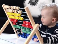 Toddler having fun with abacus Stock Footage