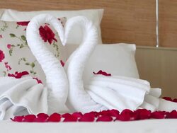 HD Romantic bedroom setup with towel and rose Stock Footage