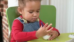 HD: Toddler Painting Easter Eggs Stock Footage