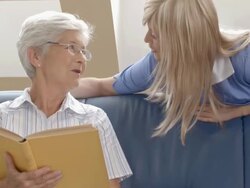 HD DOLLY: Nurse Talking With Elderly Woman Stock Footage