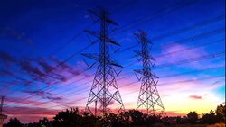 electricity high voltage power pylon at dusk Stock Footage