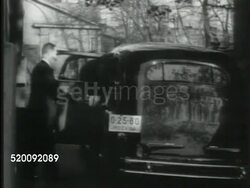 1935: MOSCOW, SOVIET UNION: WS Spaso House, US Ambassador's residence. Guest getting out of car at Spaso House. First US Ambassador to USSR (Russia) William C. Bullitt (1891-1967) in office w/ daughter Anne, Bullitt holding terrier dog, Anne sitting. Instructional Video