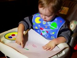 Child finger painting Stock Footage