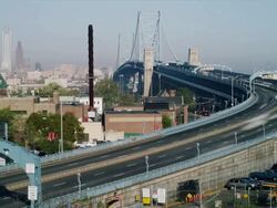 Time lapse, early morning vista with Philadelphia cityscape and traffic crossing The Ben Franklin Bridge. Stock Footage