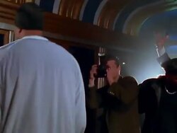 Medium shot hip hop star in tracksuit posing for photographers and groupies Stock Footage