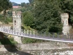 WS ZO Bridge crossing shallow river bed of Serchio river / Bagni di Lucca, Tuscany, Italy Stock Footage